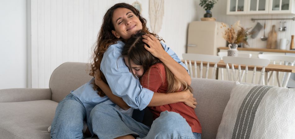 mother supporting her daughter